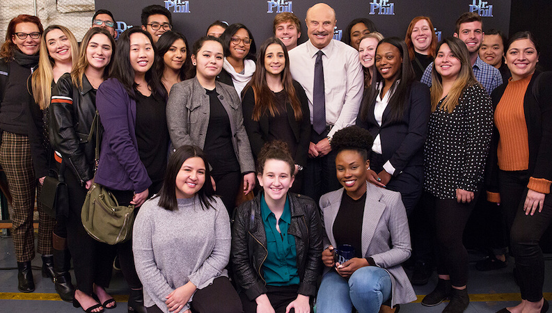 Group photo of Dr. Phil McGraw and interns