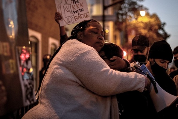 Talika Fletcher, sister of Roger Allen, consoles Tashi, 19, during a vigil and march held in honor of Roger Allen and Daunte Wright.